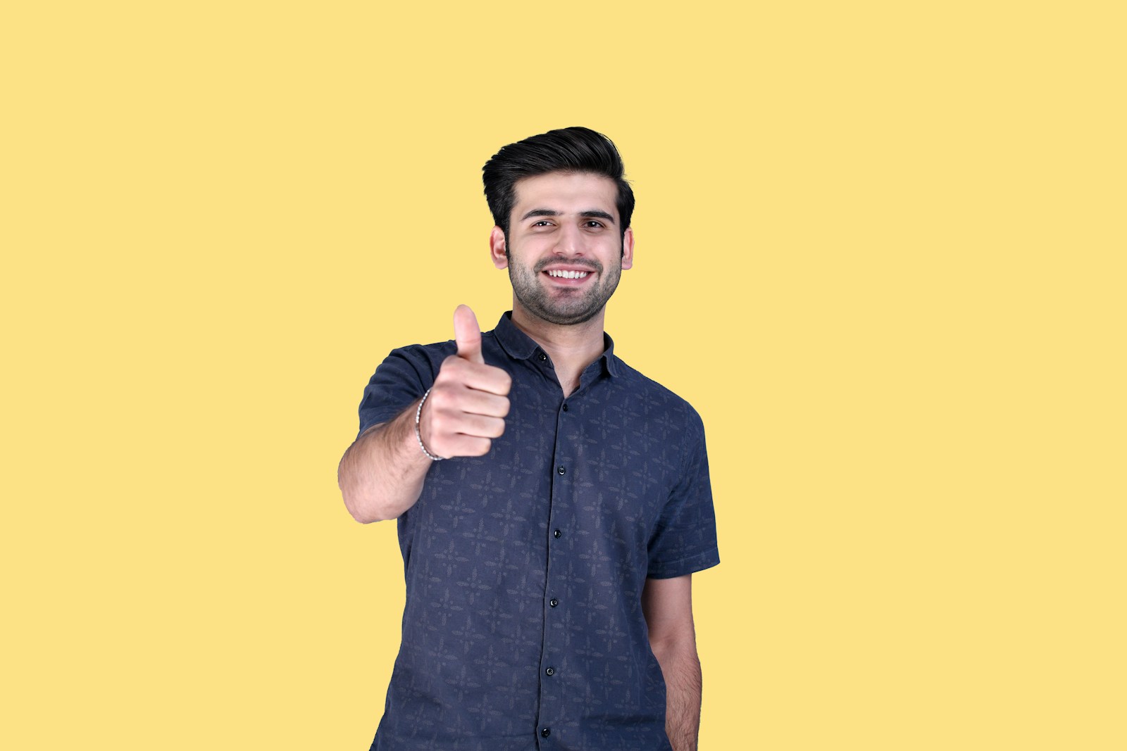 a man giving a thumbs up